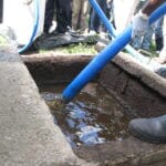 demonstration of pumping faecal sludge from a wet vip pit (8152015980)