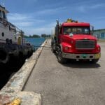 red truck parked along waterfront